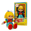 Rainbow Brite plush doll with yellow hair and a rainbow-striped outfit, shown next to its original yellow and blue packaging box on a white background.