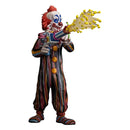 Colorful clown figurine holding a weapon with yellow spikes on a white background