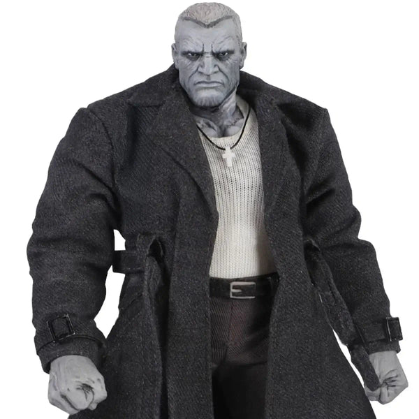 Action figure wearing a long coat on a white background