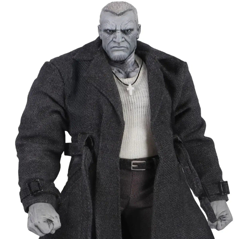 Action figure wearing a long coat on a white background