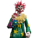 Colorful clown figurine with a smaller clown holding a toy on a white background