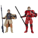Two action figures, one in a beige outfit with a weapon and the other in a red suit with a helmet, on a white background.