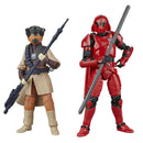 Two action figures, one in red and black armor and the other in beige and brown attire, standing side by side on a white background.