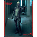 Stranger Things action figure of Vecna in a dark, industrial setting with Netflix logo.