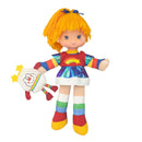 Colorful doll with a rainbow-themed outfit holding a snowman plush toy on a white background
