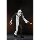 Terrifier Art the Clown Toony Terrors 6-Inch Scale Action Figure holding small horn in hand with brick wall in background