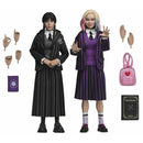 Wednesday Addams and Enid 8-Inch Clothed NECA Action Figure 2-Pack with accessories which include additional hands, back pack, and two books