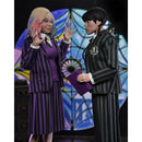 Wednesday Addams and Enid 8-Inch Clothed NECA Action Figure 2-Pack, Wednesday holding a book, and Enid with claws out