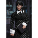 Wednesday Addams (Classic Dress) 8-Inch Clothed Action Figure holding a book