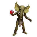 Action figure of a creature with elephant-like features holding a red ball on a white background