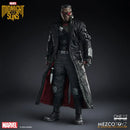 A Marvel Midnight Suns one-to-one collectible action figure of a character in a long black coat with a red lining, black tactical outfit, and red visor, posed against a dark studio background. Brand logos for Marvel, Midnight Suns, and Mezco Toyz are visible.