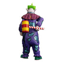 Colorful clown figurine with a striped candy cane on a white background