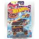 Hot Wheels Baja hauler Halloween edition toy truck in its original blister card packaging, featuring a black car with a 'Pumpkin Delivery' trailer against a colorful spooky background.