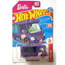 Barbie Dream Camper toy car in its original Hot Wheels blister packaging, featuring a purple camper with pink accents and cartoon characters in the cab.