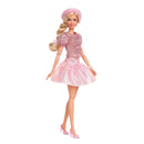 Barbie doll in a pink outfit with a matching hat on a white background
