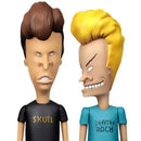 Two animated character figurines with distinct hairstyles and t-shirts on a white background