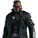 A black leather jacket with a high collar, worn by a man wearing red-tinted sunglasses and a black tactical vest. The jacket features silver metallic accents on the chest strap, belt, and sleeve.