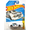A Hot Wheels die-cast toy car in its original blister packaging, featuring a BMW 635 CSI race car with white, blue, and black livery and the number 80.