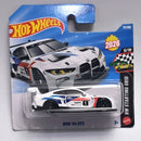 Hot Wheels BMW M4 GT3 die-cast toy car in its original blister card packaging, featuring a white car with blue and red racing stripes.