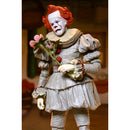 Pennywise the Clown figurine with red hair and white face holding flowers against a blurred background