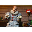 Pennywise the Clown figurine with red hair and white gloves in a wooden room setting