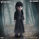 Wednesday Doll in a dark outfit standing in a forest with 'LDD Presents' and 'MEZCO TOYZ' branding.