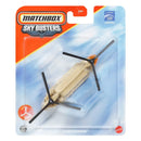 Matchbox Sky Busters CH4-47 Chinook toy helicopter in its original blister card packaging, featuring a tan body with black rotors and orange accents.
