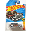 Hot Wheels Classics '55 Nomad Wagons die-cast toy car in its original blister card packaging, featuring a black, white, and orange striped design.