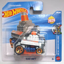 A Hot Wheels toy car in its original blister card packaging, featuring the 'Click Shift' model from the 2026 series. The packaging is blue and white with the Hot Wheels logo, and the toy itself is silver with orange and blue accents.