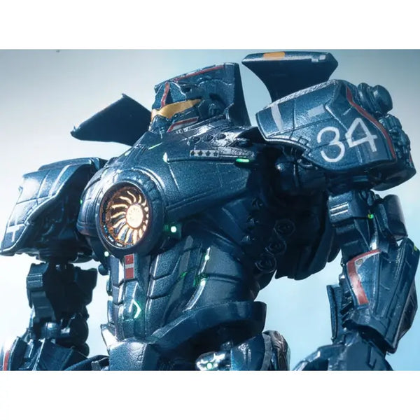 A close-up of a detailed sci-fi mecha robot in dark metallic blue-gray armor with glowing green lights, a circular orange chest emblem, and the number 34 on the shoulder, set against a pale blue background.