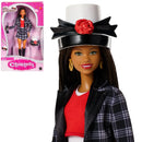 Barbie doll styled as Cher from 'Clueless' with packaging in the background