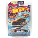 Hot Wheels Dodge Charger Stock Car die-cast toy car in its original Halloween-themed blister packaging, featuring a black car with orange and white graphics.