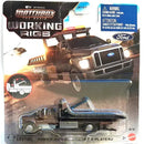 Matchbox The Movie Working Rigs die-cast toy truck featuring a black Ford F-650 Super Duty pickup with a flatbed, mounted on its original blister card packaging with a Matchbox logo and a blue Ford emblem.