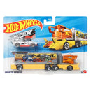 Hot Wheels Galactic Express toy car carrier set in its original blister packaging, featuring a yellow and orange transporter truck with a race car and a monster truck on the carrier bed.