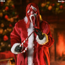 A Ghostface collectible figure dressed in a red Santa-style robe with white faux fur trim, a red hood, black gloves, and a white-and-red screaming mask, holding a candy cane in a warm holiday interior scene.