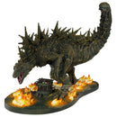 Monster figurine with flames on a white background