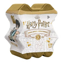 Packaging of Harry Potter magical capsules with gold accents on a white background