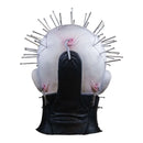Black glove holding a white balloon with pins stuck in it on a white background