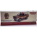 Model of a Chevrolet Blazer with police badge from 'Stranger Things' on a box