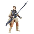 Action figure in a beige and brown outfit with a weapon on a white background