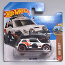 Hot Wheels Mattel Mini LIL' ROAR die-cast toy car in its original blister card packaging, featuring a white Mini Cooper S design with orange and black graphics.