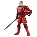 Action figure in red and black costume with a white background
