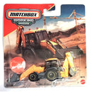 Matchbox Working Rigs MRX Backhoe toy construction vehicle in its original blister card packaging, featuring a yellow and black backhoe with a red and orange cab, set against a desert construction site backdrop on the card.