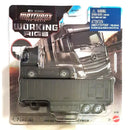 Matchbox The Movie Working Rigs die-cast toy truck set featuring a black Mercedes-Benz Actros semi-truck and matching trailer, in its original blister packaging with a blue warning label.
