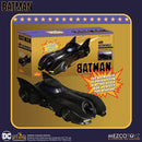 Batman toy Batmobile with packaging on a gold and blue background