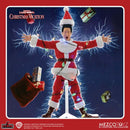 Action figure from 'National Lampoon's Christmas Vacation' by Mezco Toyz on a dynamic background.