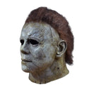 Scary Halloween Myers mask with brown hair on a white background