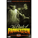 Front cover of 'The Bride of Frankenstein' assembly kit, featuring a vintage movie still of the Monster and his Bride in monochrome tones with bold orange and yellow title text