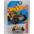 A Hot Wheels Mountain Hauler toy car in its original blister card packaging, featuring a yellow and green dump truck design with large black wheels and red rims.