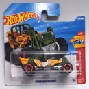 Hot Wheels Mountain Mauler toy car in its original blister card packaging, featuring an orange and green buggy-style vehicle with red wheels.